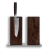 Damascus knife in wooden knife block on white background.