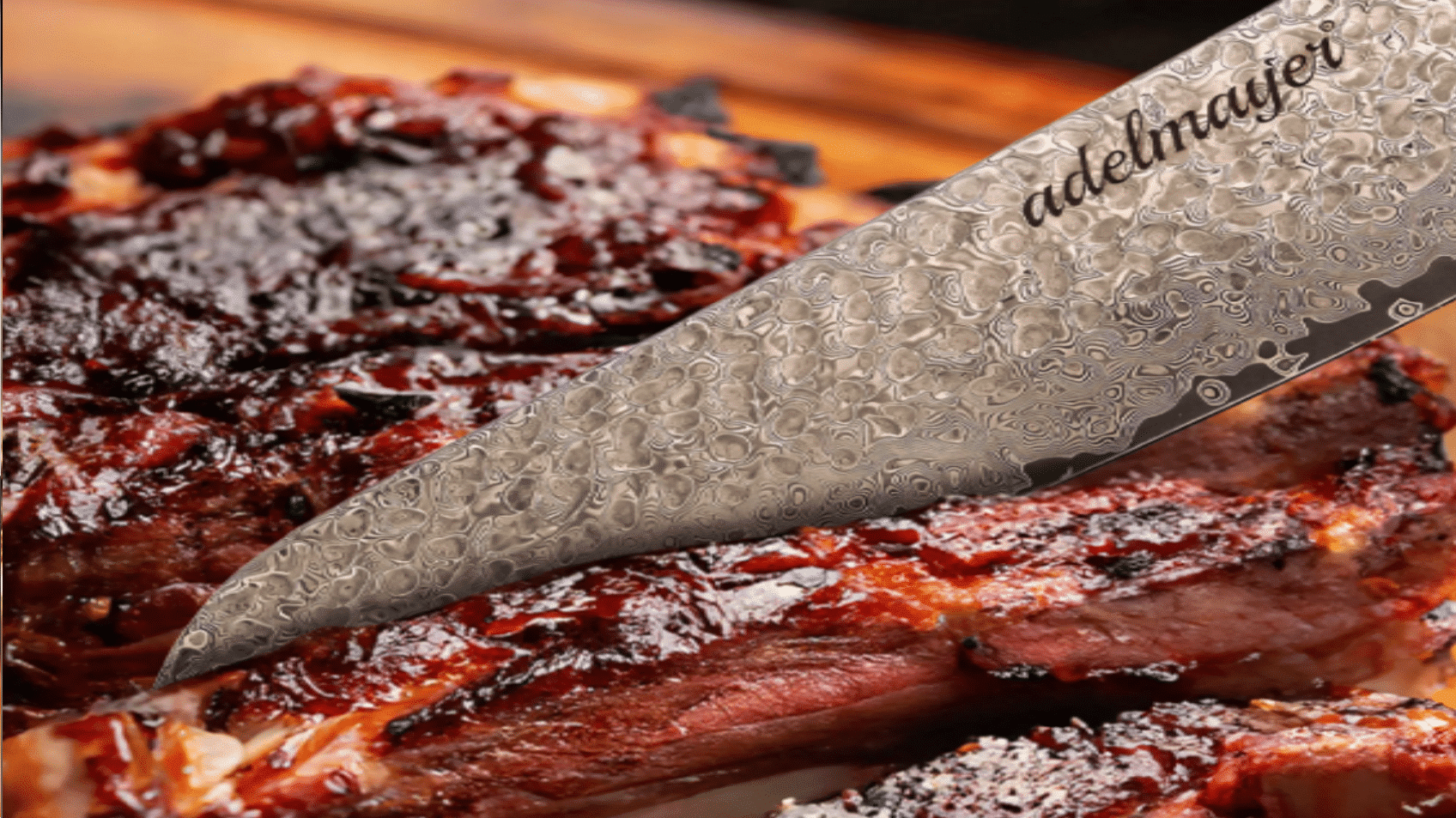 Damascus knife cuts juicy grilled meat.