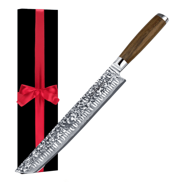 Decorated knife next to gift box with red ribbon.