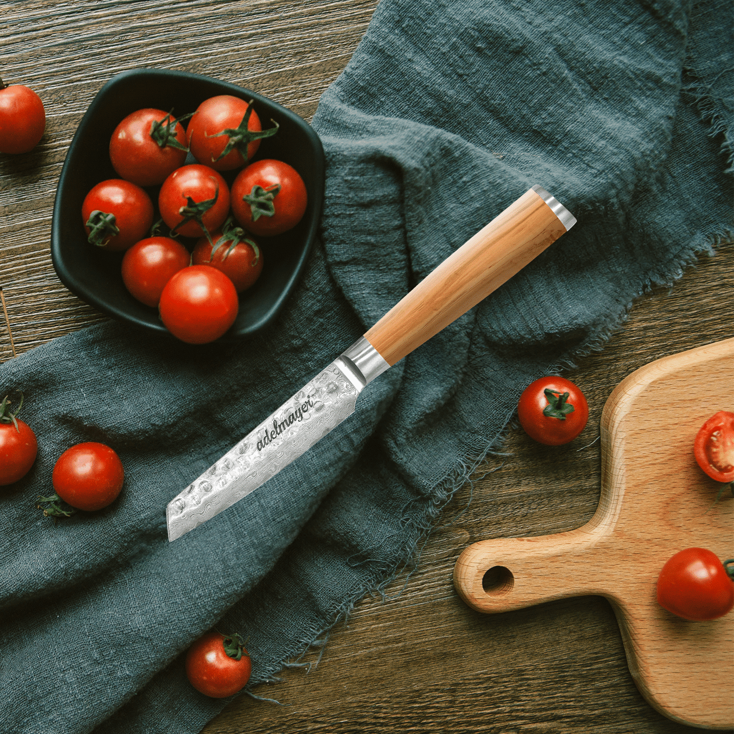 Tomatoes on wooden board with kitchen knife.