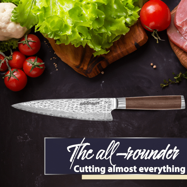 Chef's knife with vegetables on dark background.