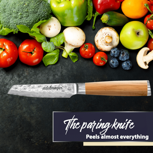 Paring knife with various fresh vegetables and fruits.